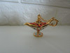 A set of ornate 6x4 cm miniature Aladdin's lamps, a must-have souvenir for tourists visiting Dubai. Shop unique artisan gifts at Craftihouse.