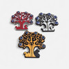A close-up of the cute squirrel and rabbit silhouettes laser-cut at the base of the Turkish Tree of Life magnet.