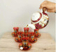 A beautiful ceramic tea pot with a warmer stand, perfect as a thoughtful, timeless gift for any sophisticated home.