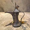 A majestic 80 cm handcrafted solid brass Arabic Dallah coffee pot featuring a traditional soaring lid and hand-etched patterns.