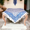 Blue and white fringed cotton tablecloth styled on dining table