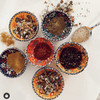 A single 8 cm assorted pattern ceramic bowl featuring vibrant traditional floral and geometric designs in rich, colorful hues.