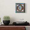 stunning 18 cm assorted pattern ceramic plate mounted inside a rustic turquoise and gold distressed wooden wall frame.