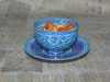 A premium 2-piece hand-painted Minakari copper set featuring a 12 cm plate and a matching 8 cm bowl with vibrant blue enamel patterns.