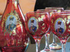 A profile view showing the elegant silhouette of the Qajar style hand-painted wine bottle with its matching decorative stopper.