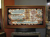 A close-up view showing the intricate machine-woven Arabic script of the Four Quls on a high-quality wall tapestry.