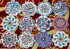 A selection of 9 cm assorted floral ceramic coasters, emphasizing the unique beauty and traditional artistic motifs in each piece.