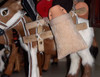A professional product display shot of the 18 cm fur donkey sculpture against a neutral and decorative background.