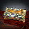 A handcrafted wooden tissue box featuring intricate Khatamkari geometric inlay and a central hunting scene motif.