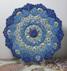 A premium 30 cm hand-painted Meenakari copper plate titled "The Azure Rosette" featuring vibrant blue and white layered floral enamel patterns.