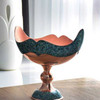 A sophisticated 25 cm copper pedestal bowl featuring artisan-quality turquoise inlay, perfect for refined home decor