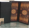 A closed 48 cm traveller backgammon set in a black PU leather suitcase with a crocodile-skin texture and sturdy handle.
