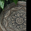 Studio display of the large 40 cm engraved copper platter showcasing detailed hand-hammered artistry and complex geometric borders.