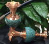 A professional product presentation of the exclusive handmade turquoise Firozeh Koobi vase pair from a premier UAE shop.