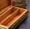 A detailed view of the intricate geometric patterns of the Khatamkari wood inlay on this premium storage set.