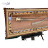 Three-quarter gallery perspective of the premium museum-grade sword framing installation, emphasizing the deep shadow box structure, rich matting texture, and three-dimensional weapon mounting layout.