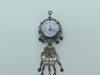 An elegant hanging clock ornament featuring intricate metalwork and a classic blue eye charm.