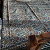 A beautiful 200x135 cm cotton tablecloth with intricate traditional block printing,
