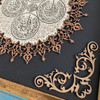 Detailed view of the polished timber grain and the hand-finished edges of the traditional Islamic wood carving.