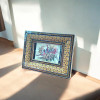 A professional product presentation of the 20x16 cm framed camel bone painting highlighting its cultural artistry.