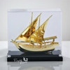 Premium mid-scale 21.5x21x9.5 cm signature gold plated Arabic dhow ship model enclosed in a luxury clear acrylic display box.