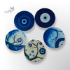 Beautifully printed ceramic coaster with a protective and decorative blue eye aesthetic.