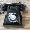 A professional product presentation of the vintage rotary dial black telephone from a premier UAE art, gift, and home decor supplier.