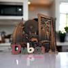 A professional product presentation of the decorative Dubai souvenir magnet from a premier UAE gift shop.il