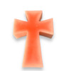 Decorative cross candle in soft pink, perfect for spiritual settings or tabletop centerpieces.