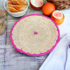 Craftihouse 28 cm handmade palm leaf tray, blending traditional weaving with a contemporary pink accent.