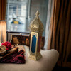Detailed view of a 43 cm lantern showcasing exquisite metalwork and vibrant glass, perfect for ambient home decor.
