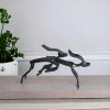 A stylish tabletop metal deer sculpture set showcasing minimalist artistic expression and clean lines.