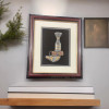 Front exhibition view of an elite traditional Arabian Khanjar dagger presented in a premium shadow box frame as a luxury corporate gift or travel memento.