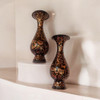 Full setting presentation of the twin traditional hand-engraved black copper vases on a modern luxury display, serving as an exceptional corporate giveaway token or elite VIP milestone travel memento.