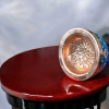 Close-up of a 16 cm copper bowl with vibrant hand-painted floral designs on a deep blue background.