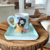 A professional product presentation of the exclusive hand-painted ceramic autumn girl mug set from a premier UAE gift shop.