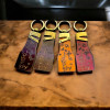 A stylish leather keychain featuring beautiful engraved calligraphy, blending durability with heritage aesthetics.