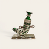 Ornate miniature Arabian dagger displayed on a luxury executive desk as a heritage-themed paperweight
