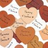 Collection of heart-shaped faux leather tags in various pastel colors with custom personalized text.