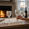 A luxury set of two hand-painted wine glasses, making a beautiful and thoughtful gift for occasions requiring a touch of artisanal elegance.