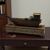 A premium Craftihouse display piece featuring a wooden dhow ship model on an inlaid wooden drawer, perfect for luxury interior decor.