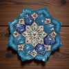 A premium 16 cm hand-painted Meenakari copper plate titled "The Cobalt Bloom" featuring vibrant blue and white floral enamel patterns.