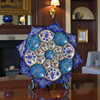 A professional product presentation of the exclusive handmade royal blue and turquoise Minakari copper art piece from a premier UAE shop.