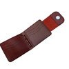 Front view of the crimson red wallet highlighting the artisanal hand-cut leather flap.