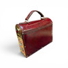 Studio presentation of the handmade Tavoos peacock art purse, serving as an exceptional luxury statement accessory or an elite VIP milestone gift.