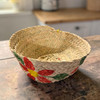 A large 23 cm hand-woven palm leaf basket with a vibrant hand-painted lid featuring traditional artisan patterns.