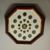 A hexagonal UAE souvenir frame featuring an artistic 3D display of real authentic Emirati coins.