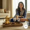 A premium porcelain Ghawa cup titled "The Golden Diwan" featuring