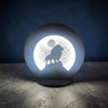 A 32 cm circular wildlife-themed table decor night lamp featuring a dark silhouette of a proud lion standing on a cliff edge set against a heavily textured lunar surface backdrop.