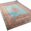 Large decorative silk carpet featuring traditional floral motifs